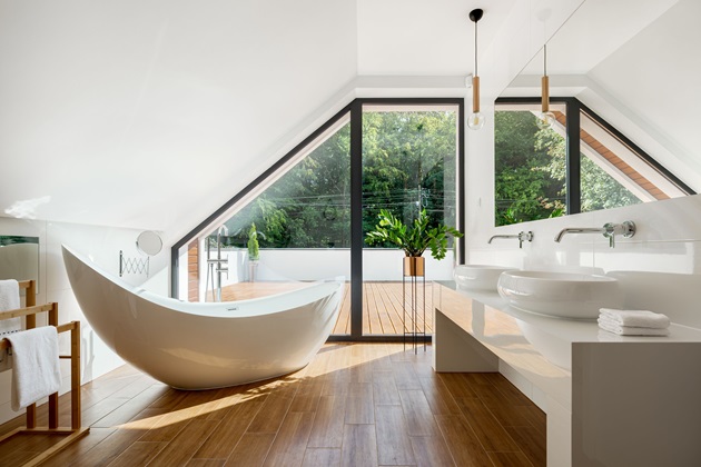 Contractor installing a walk-in bathtub for improved accessibility