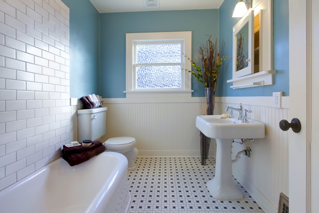 Newly installed built-in bathtub with freshly tiled surround