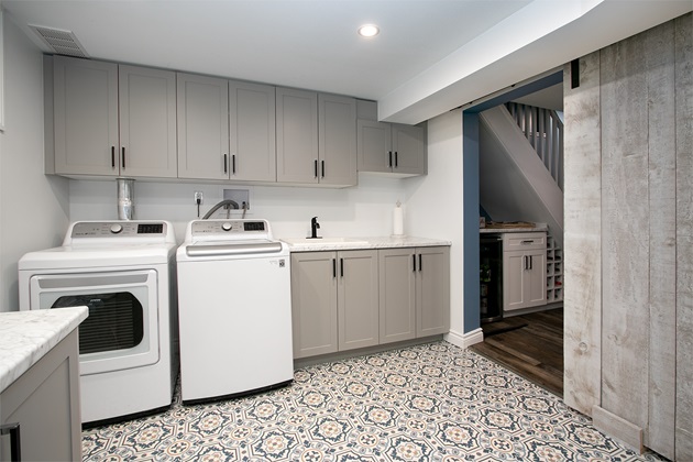 Bright, spacious laundry room with modern appliances and ample storage